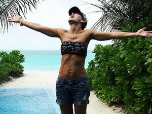 Breaktime: Emma Willis, 42, took a well deserved 'family moon' to the Maldives as she showed of her enviably trimmed body in a tiny bikini top and shorts (Source: emmawillisofficial - Instagram) Breaktime: Emma Willis, 42, took a well deserved 'family moon' to the Maldives as she showed of her enviably trimmed body in a tiny bikini top and shorts (Source: emmawillisofficial - Instagram)