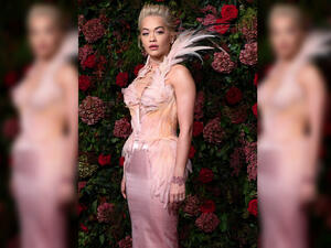 Ruffling feathers: Rita ensured she took centre stage in her bodycon dress, featuring a dramatic feathered collar, with matching detailing running down the bodice and her hips (Source: David Fisher - REX - Shutterstock) Ruffling feathers: Rita ensured she took centre stage in her bodycon dress, featuring a dramatic feathered collar, with matching detailing running down the bodice and her hips (Source: David Fisher - REX - Shutterstock)
