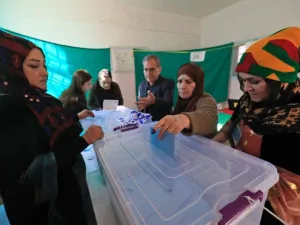 A Syrian woman casts her vote in local elections held in the Kurdish-dominated northern city of Qamishli (AFP/Delil souleiman)