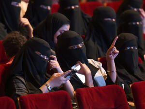Saudi women attend a rare cinema screening at a film festival in Riyadh in October 2017 (Fayez Nureldine/AFP)