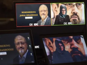 Hatice Cengiz, the fiancee of the late Washington Post journalist Jamal Khashoggi, delivers a prerecorded message (upper R) during a remembrance ceremony for her fiancée in Washington, DC (AFP)