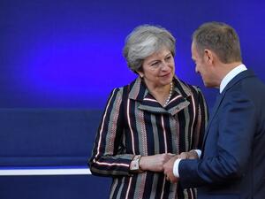  Britain's Prime Minister Theresa May (L) speaks with European Council President Donald Tusk  (AFP)