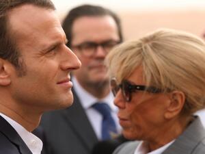 French President Emmanuel Macron (L) and his wife Brigitte  (AFP)