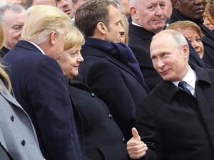 Trump and Putin in discussion as the ceremony at the Arc de Triomphe gets underway on Sunday morning (AFP)