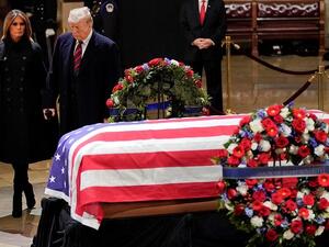 The Trumps paying final respects (AFP)