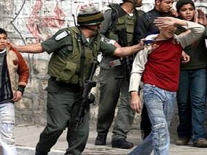 Israeli soldier has been caught on camera shooting tear gas into a Palestinian school  (Twitter)