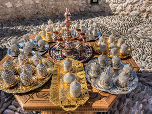Copperware, beaded decorated cans, tea caraffe, silver and golden ornamented plates (Shutterstock)