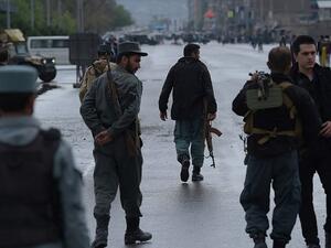 Afghan security forces at the site of a car bombing earlier on April 19. (AFP/Shah Marai)