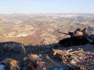 A Syrian regime tank overlooks the Latakia province. (AFP/File)