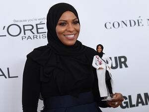US Olympic medalist Ibtihaj Muhammad with her Barbie model. (AFP)