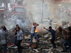 The aftermath of last week's twin suicide blasts in Beirut which left 37 dead and 181 injured. (AFP/Joseph Eid)