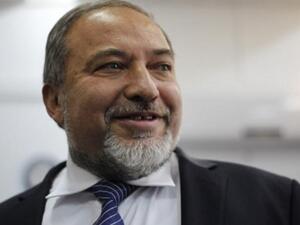 Former Israeli foreign minister Avigdor Lieberman arrives in the audience room of Jerusalem Magistrate's Court for the opening of his trail. (AFP PHOTO/POOL ARIEL SCHALIT) Former Israeli foreign minister Avigdor Lieberman arrives in the audience room of Jerusalem Magistrate's Court for the opening of his trail. (AFP PHOTO/POOL ARIEL SCHALIT)