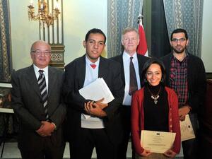 Beaming prizewinners collect their awards.
