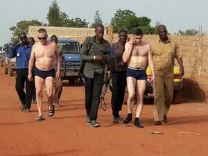Malian security forces escort to safety hostages outside the Kangaba Le Campement in the outskirt of Bamako on June 19, 2017 a day after suspected jihadists stormed the resort, briefly seizing more than 30 hostages and leaving at least two people dead. (Fototala King Massassy/AFP)