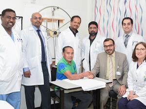 Dr. Mohamed Murshid Al Delaimi, Senior Consultant, Plastic and Hand Surgeon and patient, Mr. Jose Mari Jay.