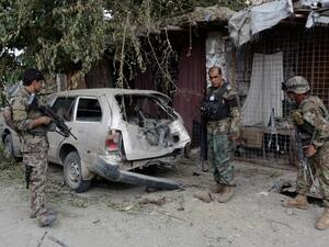 Afghan soldiers inspect a destroyed vehicle after an operation to capture Islamic State fighters in Kot District in eastern Nangarhar province on July 26, 2016. (AFP/Noorullah Shirzada)