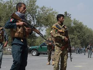 Afghan security personnel keep watch at the site of a suicide attack outside a bank near the US embassy in Kabul on August 29, 2017 (AFP)
