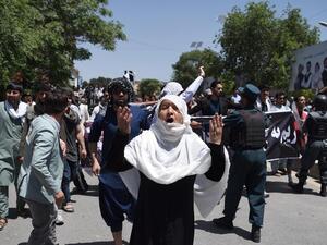 Afghan protesters shout anti-government slogans during a protest against the government following a truck bomb attack near Zanbaq Square on 2 June. (AFP/ Wakil Kohsar) 