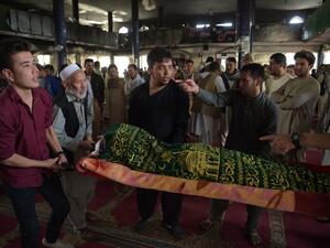 Afghan mourners carry the coffin of one of the 28 victims of a suicide attack, on a Shiite mosque a day earlier, in Kabul on August 26, 2017 (AFP)