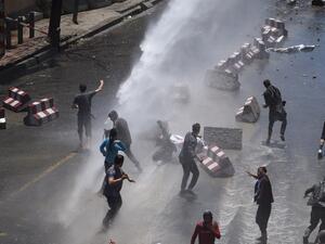 Afghan security forces use water canons to disperse protesters during clashes at a protest against the government following a catastrophic truck bomb attack near Zanbaq Square in Kabul on June 2, 2017. (Wakil Kohsar/AFP)