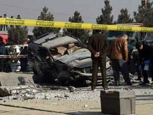 Afghan security personnel inspect a damaged vehicle after a roadside bomb explosion in Kabul. (AFP/ File Photo)
