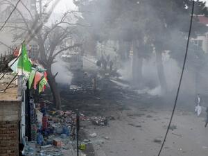 Afghan firefighters work to extinguish fire at the site of an explosion in Kabul on March 13, 2017. (AFP/Wakil Kohsar)