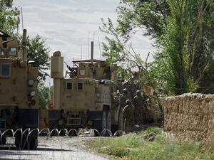US soldiers inspect the site of a separate roadside bomb blast at Abed Kheel near Charikar district of Parwan province on May 19, 2017. (Wakil Kohsar/AFP)