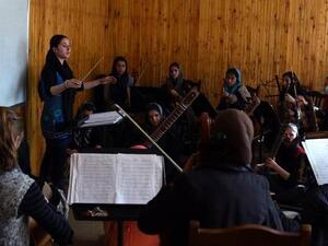 In this January 8, 2017 photo, Negina Khpalwak (19), the first female orchestra conductor in Afghanistan, is seen during a rehearsal at the National Institute of Music in Kabul. (AFP/File) 