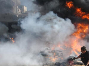 A Palestinian man rushes to the scene moments after an Israeli airstrike on Rafah, in the southern Gaza Strip. (AFP/ File)