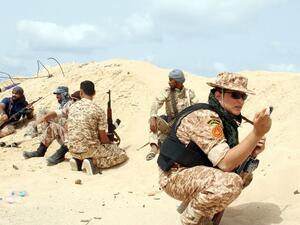 Fighters from the pro-government forces loyal to Libya's Government of National Unity hold a position as they target the Islamic State group in Sirte, June 2016. (AFP/File) 