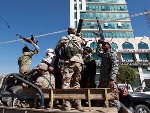 Houthi fighters drive through the Yemeni capital Sanaa (AFP/Mohammed Huwais)