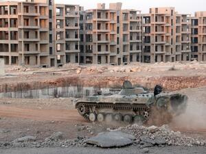 Opposition fighters drive a tank in an eastern government sieged neighbourhood of Aleppo as jihadists and their rebel allies pressed an offensive on August 5, 2016. (AFP/Omar Haj Kadour)