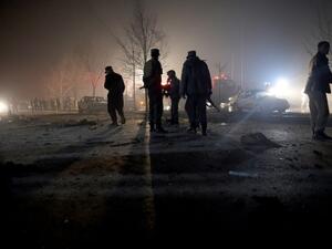 Afghan security personnel inspect the area near the site of an attack by a suicide bomber against a vehicle carrying employees of popular Afghan TV channel TOLO in Kabul on January 20, 2016. (AFP/File) 