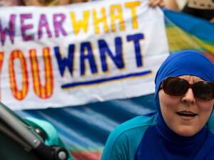A woman wearing a burkini joins a protest outside the French embassy in London on August 25, 2016 against the banning of the Islamic swimwear on some French beaches. (AFP/Justin Tallis)