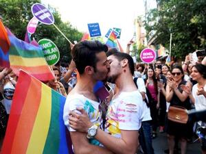 A gay couple kisses during the Gay Pride parade on June 28, 2015 in the Istiklal street near the Taksim square in Istanbul (AFP/file)