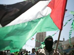 A Palestinian militant and Hamas supporter takes part in an anti-Israeli protest in the southern Gaza Strip town of Khan Yunis in September 2015. (AFP/Said Khatib)
