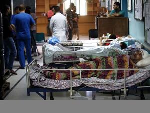 Palestinian patients lie on hospital beds in the Al-Wafa rehabilitation hospital near Gaza City.  (AFP/Thomas Coex)