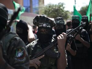 Palestinian Hamas militants take part in a 2015 anti-Israeli protest in the southern Gaza Strip town of Khan Yunis. (AFP/Said Khatib)