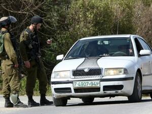 Israeli border guards check a driver near the Palestinian town of Qalqilya in the occupied West Bank. (AFP/Jaafar Ashtiyeh)