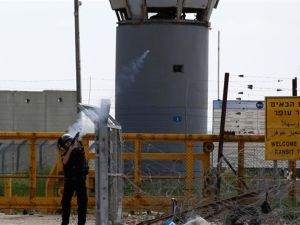 An Israeli soldier fires tear gas canisters towards Palestinian protesters outside the compound of the Israeli-run Ofer prison. (AFP/File) 