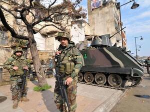 Lebanese soldiers are seen deployed on a street in the northern Lebanese city of Tripoli on March 14, 2014. (AFP/Ibrahim Shalhoub)