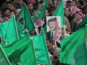 Jordanians wave Muslim Brotherhood flags in Amman in 2007 (AFP/File)