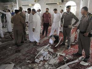 Saudi policemen gather around debris following a blast inside a mosque in Qatif. (AFP/File) 