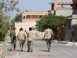Fighters from the pro-government forces loyal to Libya's Government of National Unity (GNA) walk on August 3, 2016 in Sirte during an operation against Daesh. (AFP/File)  