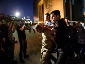 Police escort soldiers in a roundup after a military coup in Turkey (AFP/Ozan Kose)