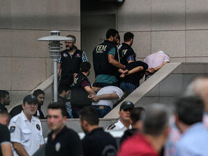 Detained Turkish soldiers who allegedly took part in a military coup arrive with their hands bound behind their backs at the Istanbul Justice Palace on July 20, 2016, following the failed military coup attempt of July 15. (AFP/Ozan Kose) 