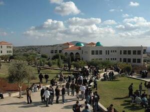Students arrive at the Arab American University in Jenin, West Bank. (Wikimedia Commons)