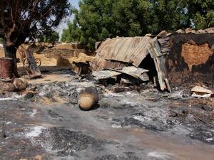 A picture taken on December 17, 2018 shows mud houses burnt down by Boko Haram fighters in the Maiborti village, on the outskirts of Maiduguri, northeast Nigeria. Hundreds fled late on December 16, 2018 after Boko Haram burned their homes near Nigeria's northeastern city of Maiduguri, residents told AFP. Boko Haram fighters in several trucks stormed Maiborti village, five kilometres (miles) outside Maiduguri, firing indiscriminately and setting fire to homes, they said. AUDU MARTE / AFP