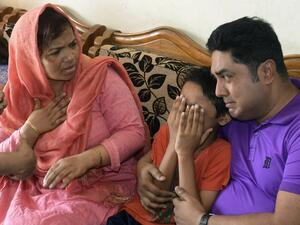The young son of Mahmuda Aktar, the wife of a top Bangladeshi anti-terror officer, mourns after she was shot dead near her home in Chittagong on June 5, 2016. (AFP/