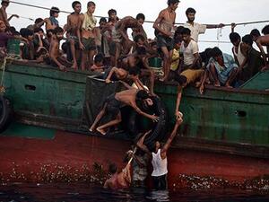 Rohingya stranded off the coast of Thailand in May. (Christophe Archambault/ AFP)